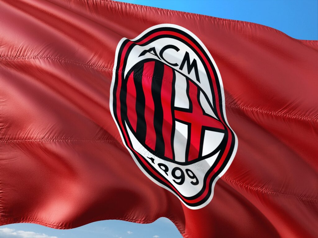 Bordowa, powiewająca flaga z logo AC Milan